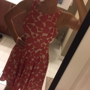 Pink patterned dress, cut out back.